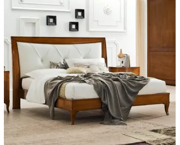 Letto Aurora in legno con testiera in pelle di Le Fablier